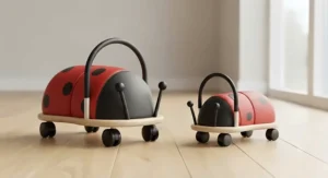 Small and large Wheelybug ladybird ride-on toys placed side by side for size comparison.