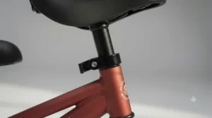 Adjustable, padded saddle on a steel balance bike designed to grow with your toddler.