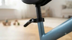 Close-up of an adjustable seat clamp on an ergonomic first balance bike for growing toddlers
