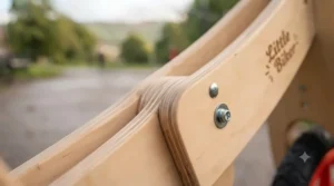 Sustainable birch plywood frame of a wooden balance bike finished with non-toxic child-safe varnish.