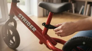 A smiling child who learned spatial awareness on a Strider balance bike now confidently riding a pedal bicycle